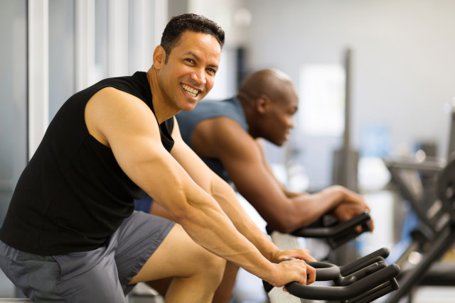 two men doing indoor biking