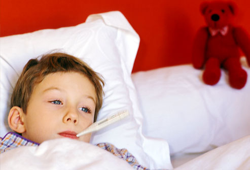 photolibrary_rm_photo_of_boy_in_bed_with_fever