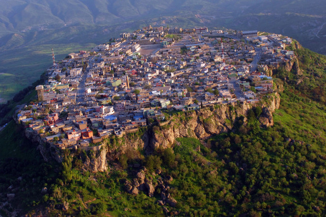 The picturesque village of Amedye, Iraq, sits on a mountain top between the desert and the fertile lands of Northern Iraq. Soldiers from Command Post-North, Task Force Lightning, flew over the village after taking part in Kurdish Labor Day celebrations nearby, May 1.