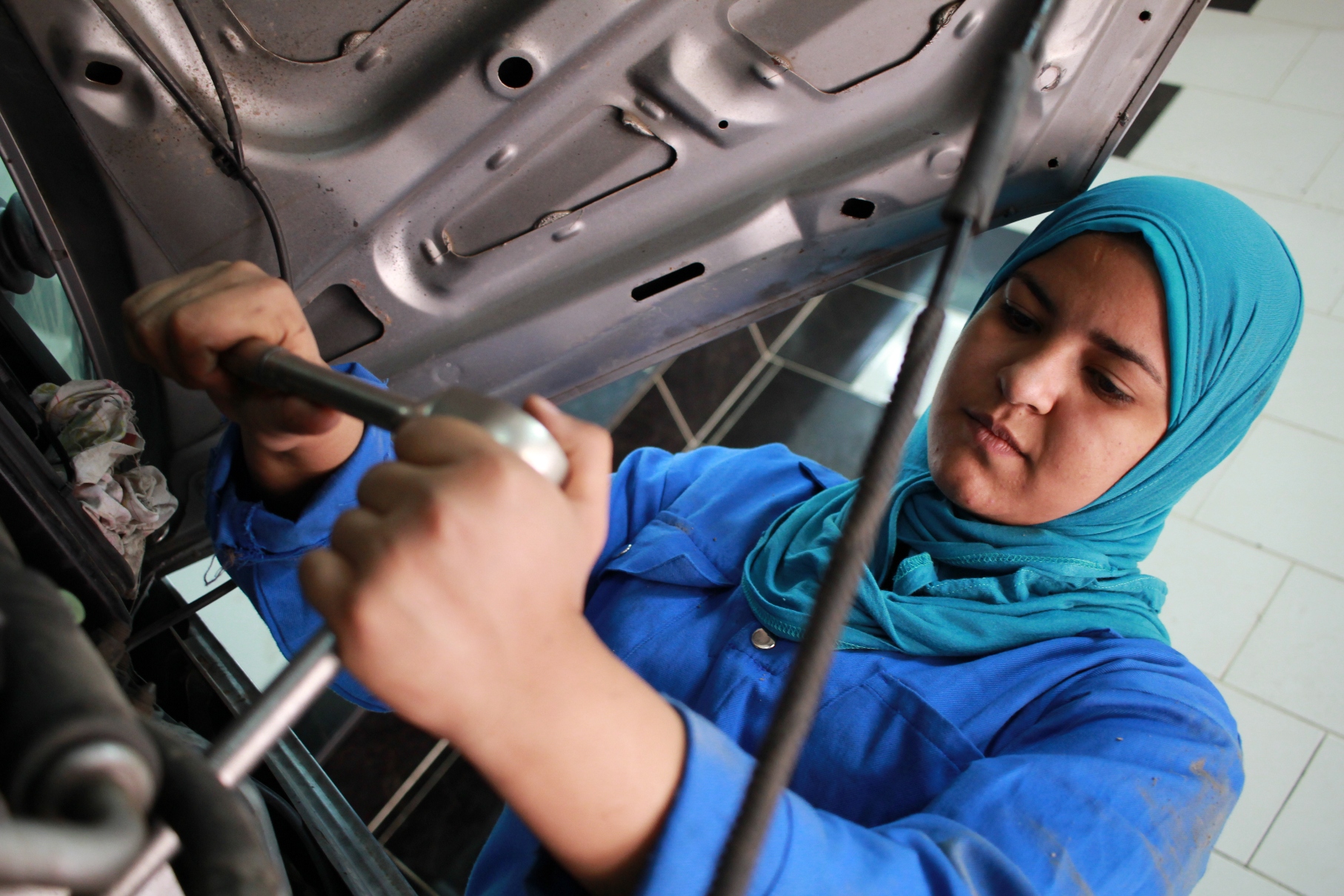 Mechanic fixes. Woman Mechanic. Mechanical women.