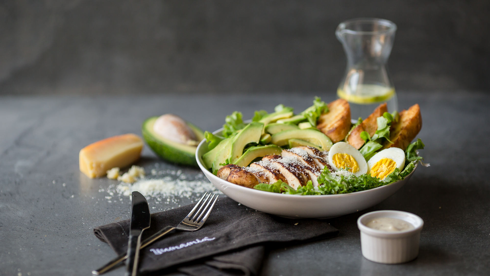 Taking the famous salad to the next level with tender grilled chicken breast, avocado slices, hard boiled egg, slices of buttered toasted bread, crispy lettuce, and shredded Parmesan cheese with our own caeser dressing.