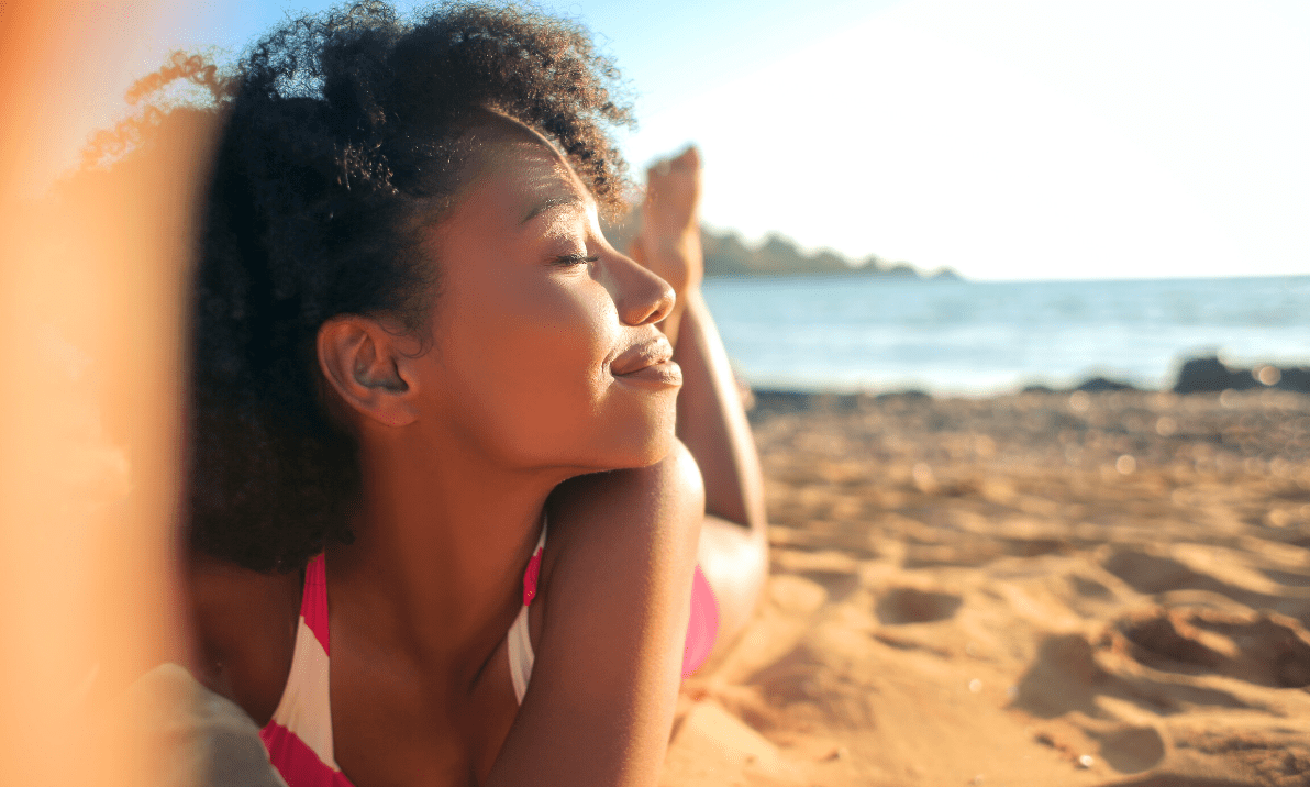 Summer skin. Women basking in the Sun on the Beach.