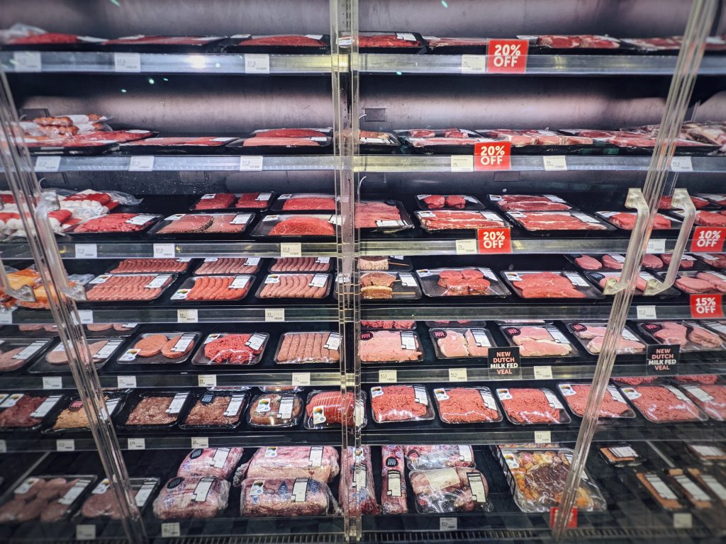 Comparison of a traditional butcher and an up-marker supermarket.